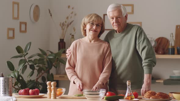 Portrait of Happy Senior Couple in Kitchen