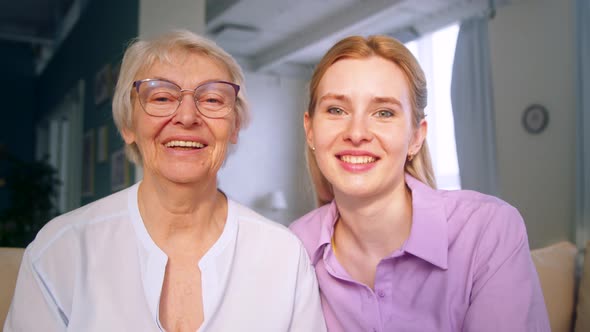 Mother and daughter doing video chat for distance communication at home