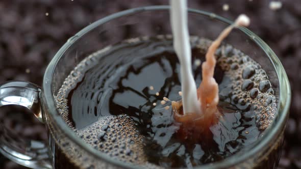 Cream pouring into coffee in slow motion; shot on Phantom Flex 4K at 1000 fps alt