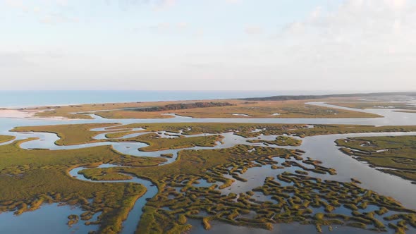 Sunset flight over wetlands in Murrells Inlet SC away from beach