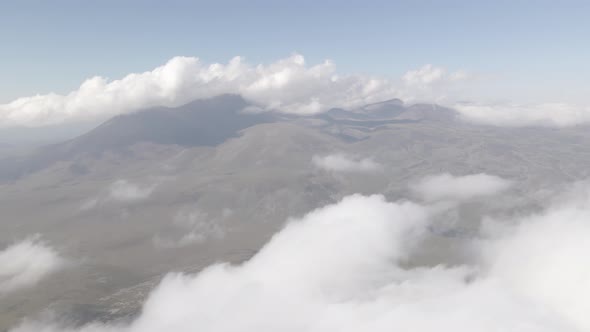 Scenic aerial view of moving white clouds at Abuli Mountain. Georgia