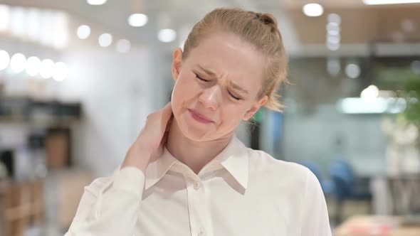 Portrait of Tired Young Businesswoman Having Neck Pain