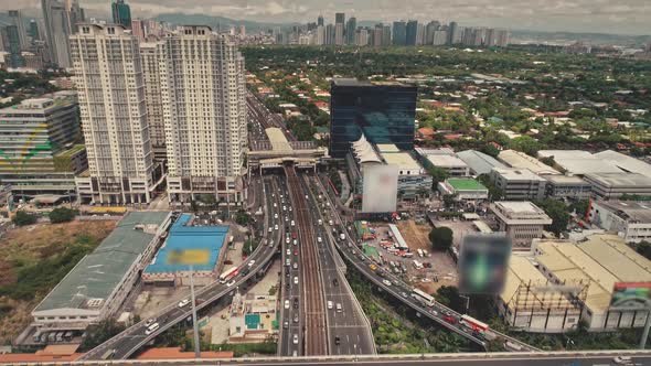 Wide Traffic Highway Road at Skyscrapers and Billboards Aerial