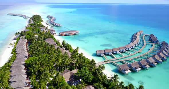 Daytime flying clean view of a white sand paradise beach and aqua turquoise water background in best