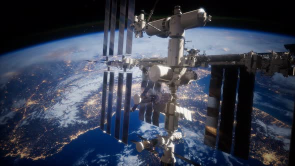 A View of the Earth and a Spaceship. ISS Is Orbiting the Earth alt