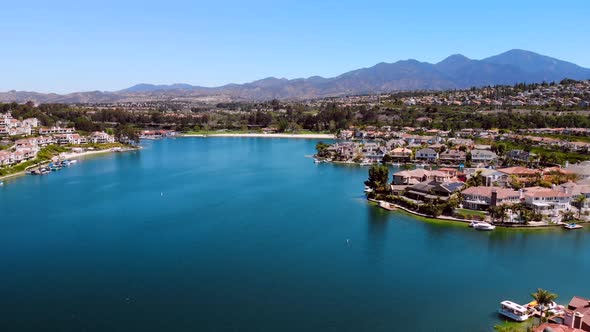 Aerial fly down the middle of community lake mission viejo