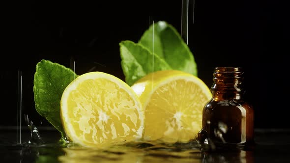 Lemon Halves and Bottle in Water Closeup Lemon Juice