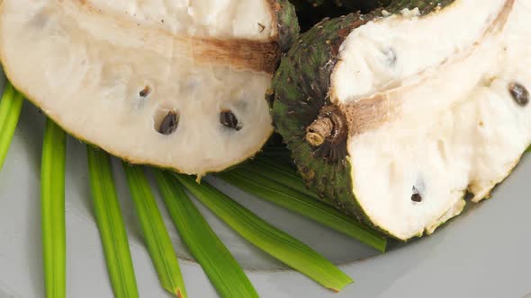 Closeup of Green Soursop Graviola, Exotic, Tropical Fruit Guanabana on Plate