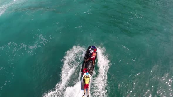 Aerial view of lifeguard surf rescue jetski personal watercraft in Hawaii