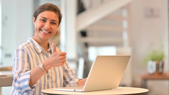 Young Indian Woman with Laptop Doing Thumbs Up