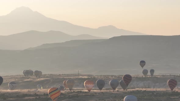 Aerial View of Natural Rock Formations in the Sunset Valley with Cave Houses in Cappadocia Turkey