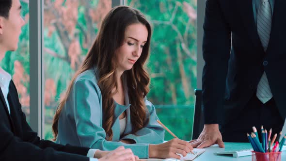 Smart Businessman and Businesswoman Talking Discussion in Group Meeting