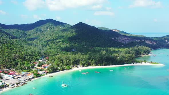 Aerial seascape of beautiful tourist beach holiday by shallow ocean and clean sand background of a d