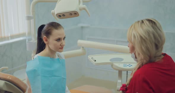 Nice Girl at the Reception at the Doctor in a Modernly Equipped Clinic