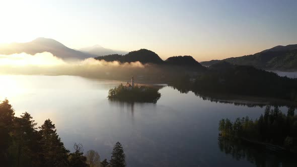 Flying over lake Bled towards the hills and mountains