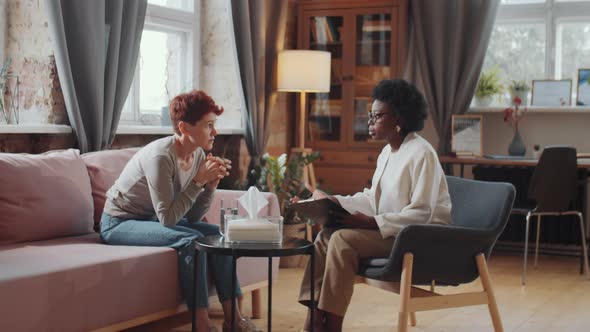 Caucasian Woman on Therapy Session with African American Psychologist