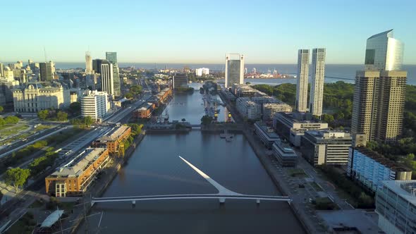 Aerial descending over Puerto Madero neighborhood at sunrise in Buenos Aires