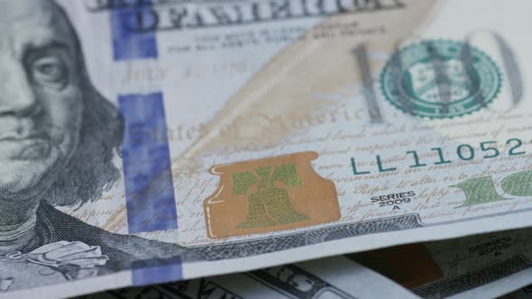 Rotating stock footage shot of $100 bills