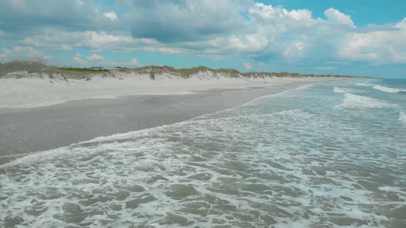 drone shots of the sand dunes and marsh lands at the coast