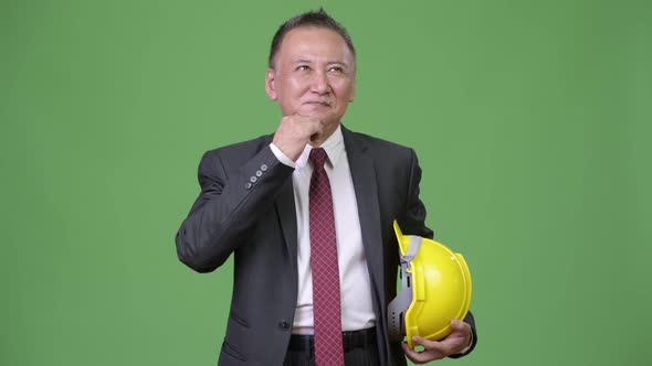 Mature Japanese Businessman As Engineer Thinking