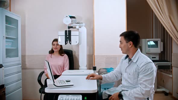 Young Woman Checking Her Visual Acuity on an Optometric Equipment