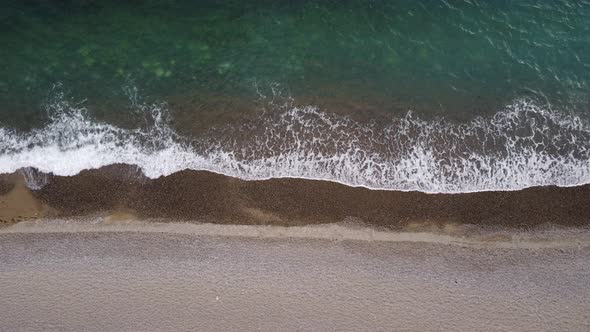 Aerial View From Above on Azure Sea and Pebbles Beach