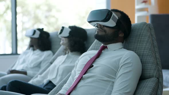 Relaxed Business People in Vr Headsets