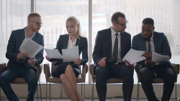 Young Diverse Candidates Chatting While Waiting for Job Interview