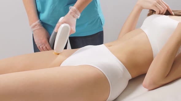 Woman Get Laser Epilation Treatment at Beauty Clinic