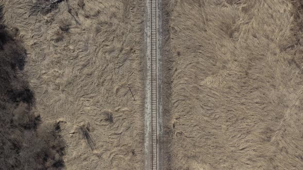 Slow flight above abandoned railroad 4K aerial footage
