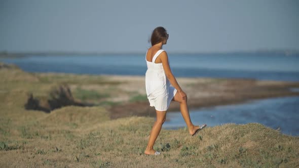 Girl in a White Dress in Nature