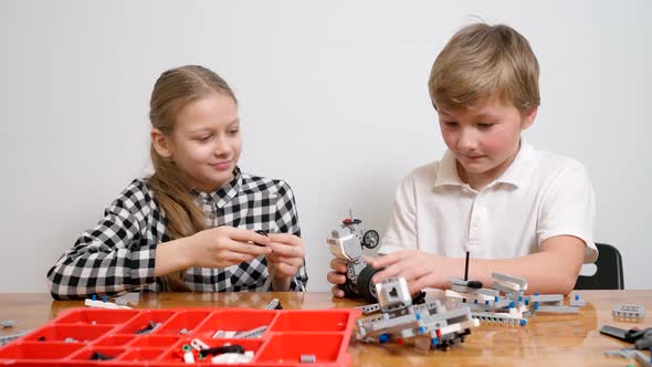 Young Friends Having Fun Using Building Kit