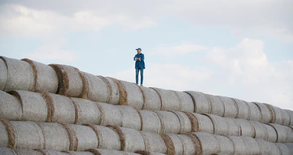 Successful Farming Concept, Positive Farmer Looking on Crops.