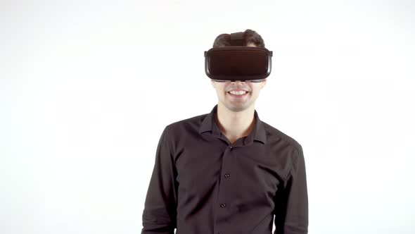 Man Playing in Virtual Reality Goggles
