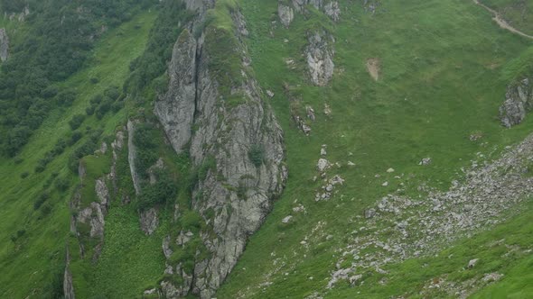 Stones and Rocks on Mountain Range with Green Grass