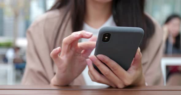 Business woman use cellphone fro online