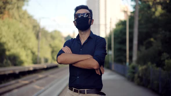 Man Waiting Train In Protective Mask Sars COVID19 Virus. Pandemic Coronavirus Protection Outdoor.