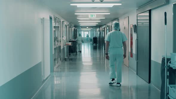 Surgeons are Walking Along the Hospital Corridor