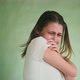 Crying Young Woman Hugs Herself and Closes Face with Palms - VideoHive Item for Sale