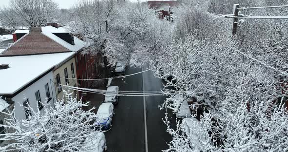 Snow covered trees in American town. Aerial during snowstorm in USA town winter scene. Pretty scene.