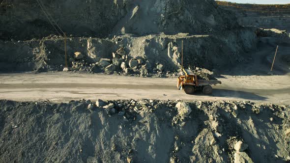 Mining car machinery to transport coal. Open pit mine quarrying extractive industry stripping work.