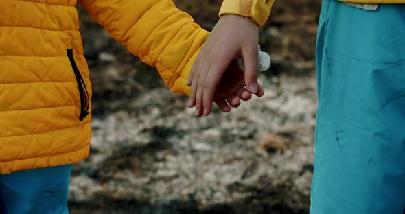 The Younger Sisters Dressed in the Colors of the Ukrainian Flag Holding Hands