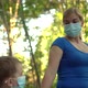 Mother and Child in Medical Masks Walk in the Park - VideoHive Item for Sale