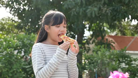 Beautiful Asian Girl Eating Eating Pizza Outdoor