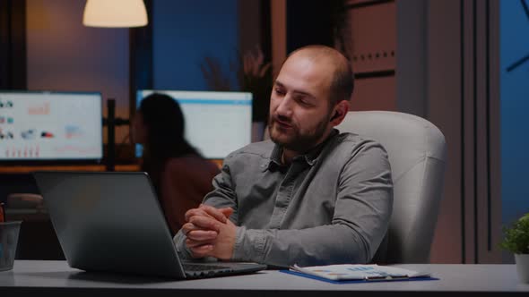 Businessman Wearing Headphone During Company Teammeeting Conference