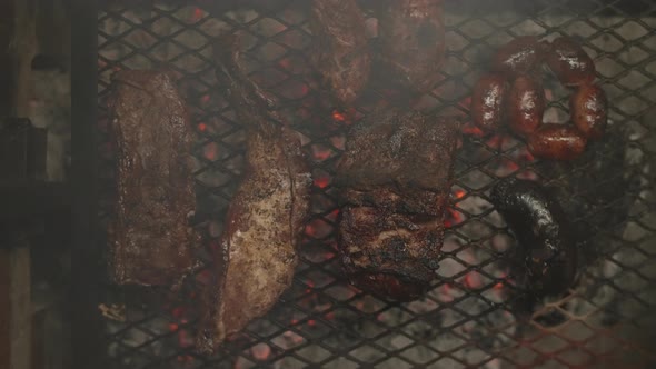 Top view of an Argentine asado with grilled meats and sausages