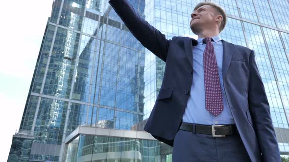 Ambitious Businessman Pointing with Finger