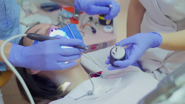 Dentist hands treating a patient