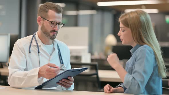 Doctor Talking to Worried Female Patient