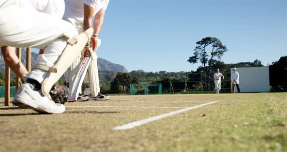 Bowler delivering ball during cricket match